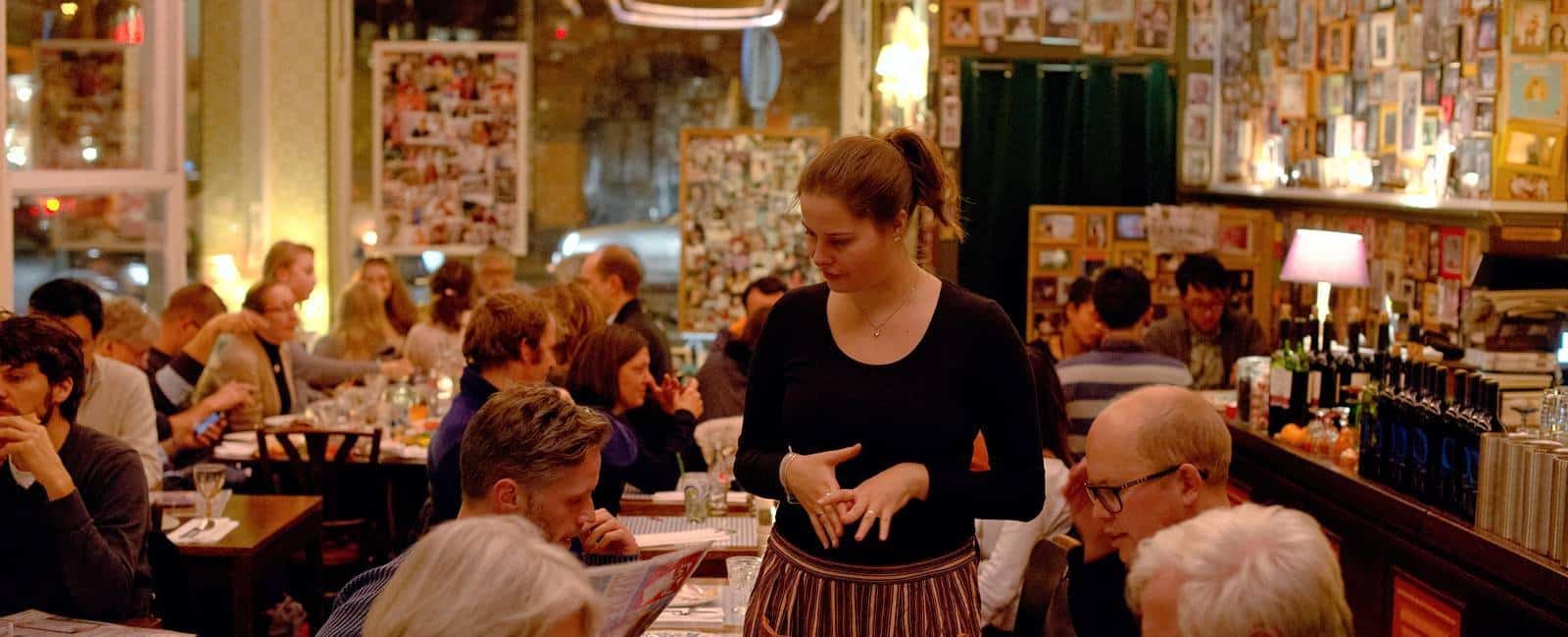Moeders restaurant in Amsterdam with wall covered in photos of mothers