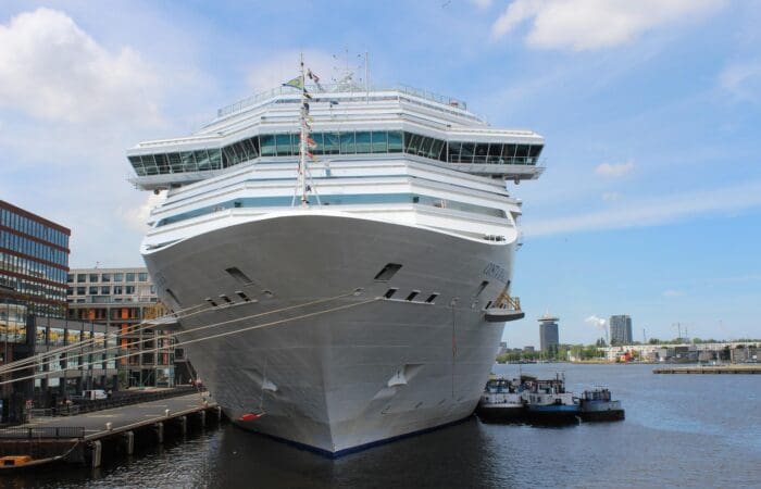 Cruise ship docked at Amsterdam Passenger Terminal for private shore excursions