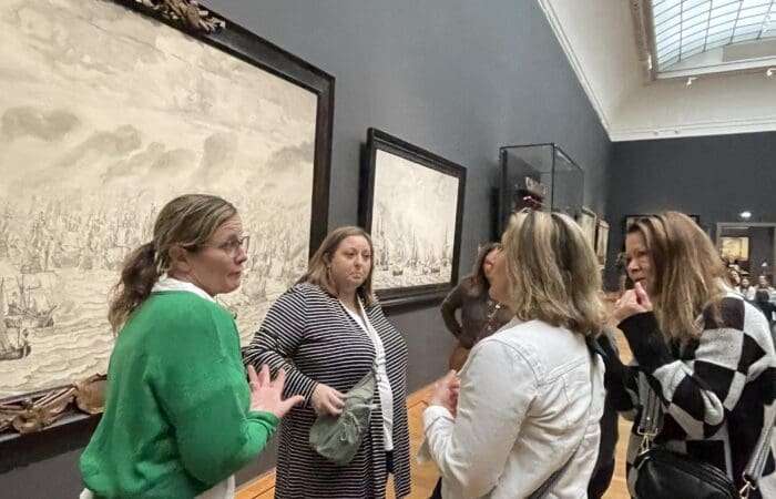 Amsterdam Experiences guide leading a tour inside the Rijksmuseum