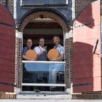 Cheese expert leading a Dutch cheese tasting in an old Amsterdam canal house