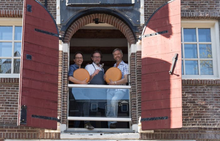 Cheese expert leading a Dutch cheese tasting in an old Amsterdam canal house