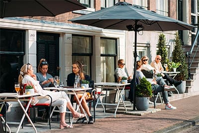An outdoor café terrace in Amsterdam, where many visitors simply round up the bill