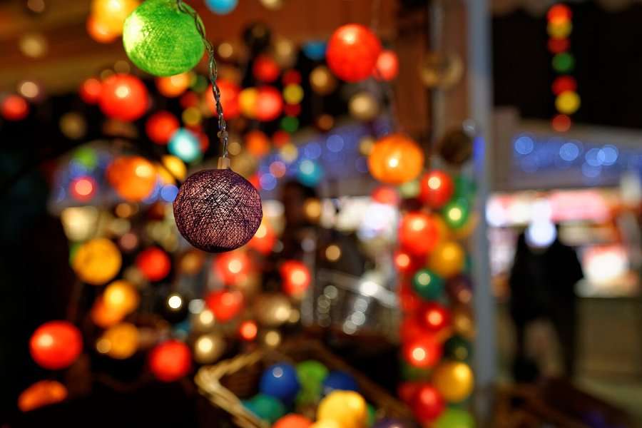 Colourful Christmas lights and a bauble (generic Christmas market detail)